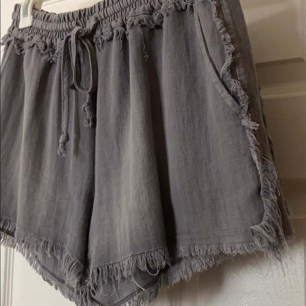 Distressed charcoal gray fringe shorts